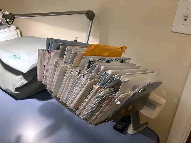 A shelf full of letters received.